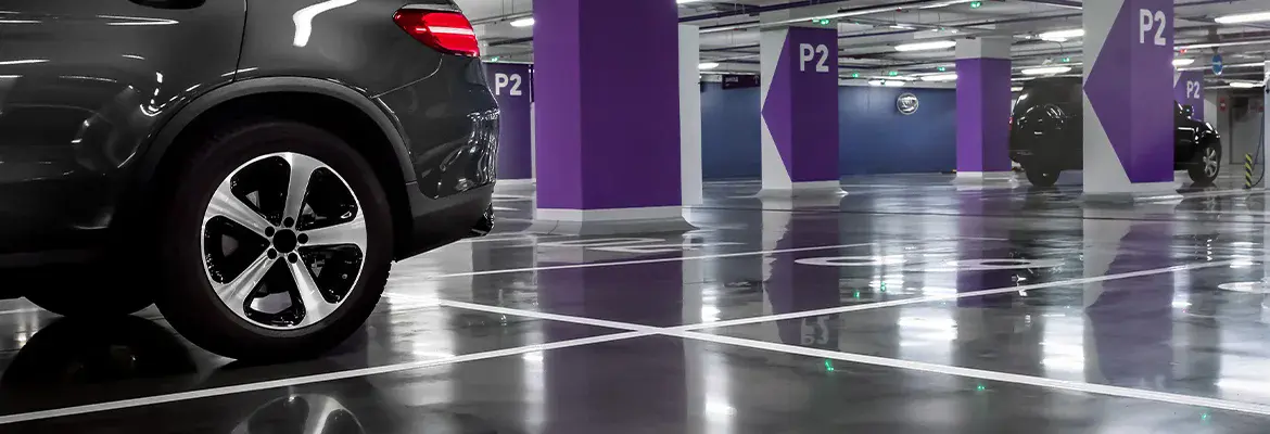 SUV in a parking garage, shiny parking garage flooring